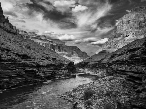A black and white photograph of the Colorado River from a ledge high above Randys Rock camp in the Grand Canyon.
